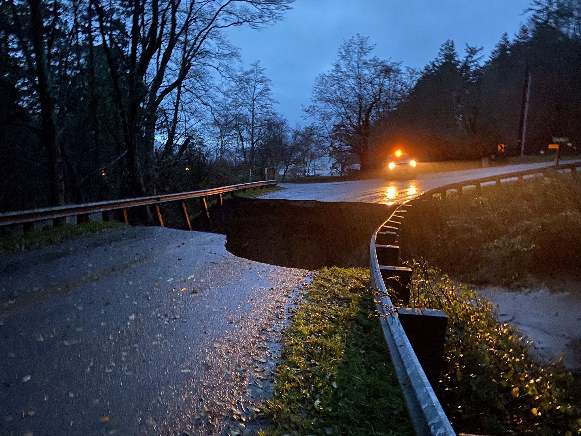 Heavy rains washed away a stream bank, collapsing an island road